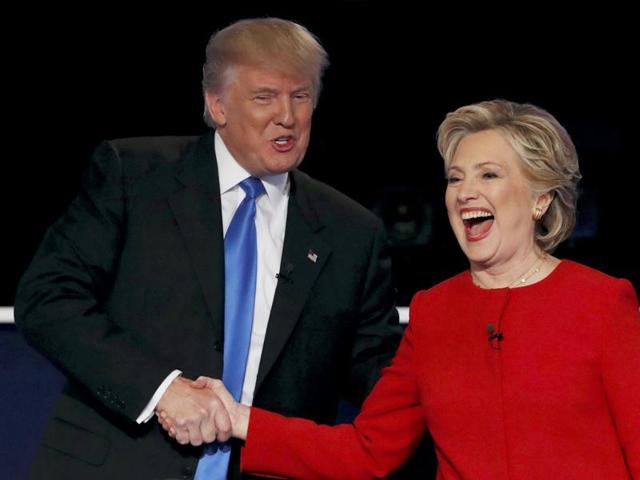 Republican US presidential nominee Donald Trump shakes hands with Democratic US presidential nominee Hillary Clinton at the conclusion of their first presidential debate at Hofstra University in Hempstead, New York. (Reuters File Photo) Republican US presidential nominee Donald Trump shakes hands with Democratic US presidential nominee Hillary Clinton at the conclusion of their first presidential debate at Hofstra University in Hempstead, New York. (Reuters File Photo)