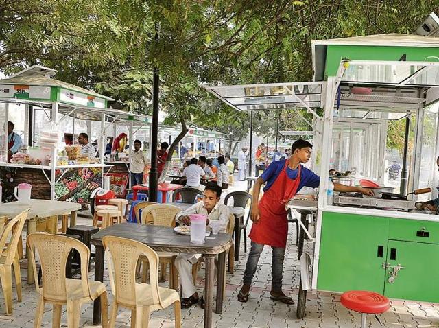 As a pilot project, 20 hawkers were set up on an empty spot adjacent to the main road, to avoid snarls in the area which sees heavy traffic. From paranthas, vegetarian dishes, maggi, bread and egg, hot and cold beverages, rajma chawal and kadhi chawal, these items cost between Rs 15 and Rs 70(Parveen Kumar/HT photo) As a pilot project, 20 hawkers were set up on an empty spot adjacent to the main road, to avoid snarls in the area which sees heavy traffic. From paranthas, vegetarian dishes, maggi, bread and egg, hot and cold beverages, rajma chawal and kadhi chawal, these items cost between Rs 15 and Rs 70(Parveen Kumar/HT photo)