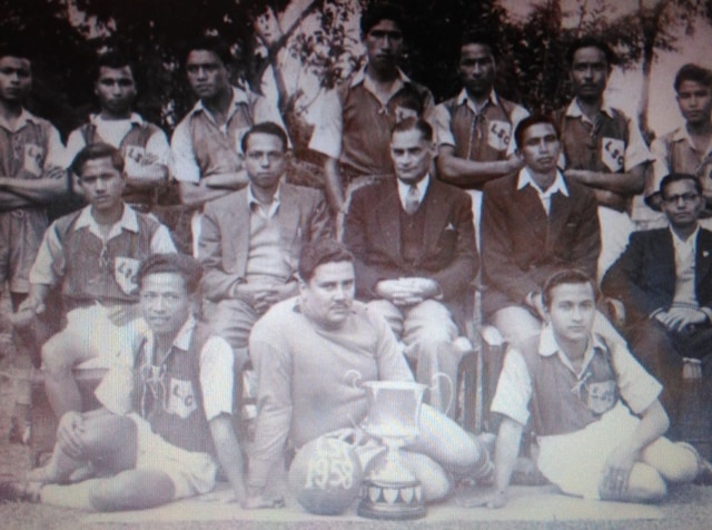 Herbert Winston Vaughan (sitting on floor with trophy and football) with teammates in Aizawl. (HT Photo) Herbert Winston Vaughan (sitting on floor with trophy and football) with teammates in Aizawl. (HT Photo)