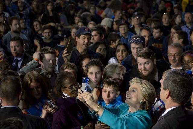 Democratic presidential nominee Hillary Clinton takes selfies with supporters after speaking a rally at the Cleveland Public Auditorium November 6, 2016. (AFP) Democratic presidential nominee Hillary Clinton takes selfies with supporters after speaking a rally at the Cleveland Public Auditorium November 6, 2016. (AFP)