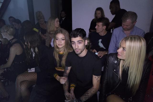 Model Gigi Hadid, left, and singer Zayn Malik at the Versus show during London Fashion Week, September 17. (NYT)