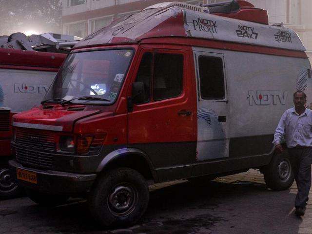 A man walks in a parking lot of NDTV office in New Delhi.(AFP Photo) A man walks in a parking lot of NDTV office in New Delhi.(AFP Photo)