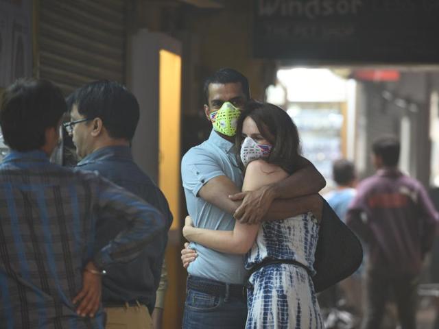 Delhi has experienced the worst smog in 17 years. This has led to a rush in the capital for air purifiers and masks. In this photo, a couple can be seen wearing masks at Khan Market in New Delhi. (Arun Sharma/HT PHOTO) Delhi has experienced the worst smog in 17 years. This has led to a rush in the capital for air purifiers and masks. In this photo, a couple can be seen wearing masks at Khan Market in New Delhi. (Arun Sharma/HT PHOTO)