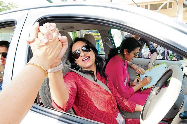 Woman sarpanch Bhakti Sharma takes part in women car rally in Bhopal on Sunday. (Mujeeb Faruqui/HT photo) Woman sarpanch Bhakti Sharma takes part in women car rally in Bhopal on Sunday. (Mujeeb Faruqui/HT photo)