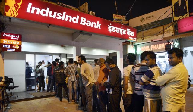 People queue outside an ATM in NoidaSector 12 in a rush to get Rs 100 notes. (Mohd Zakir/HT Photo) People queue outside an ATM in NoidaSector 12 in a rush to get Rs 100 notes. (Mohd Zakir/HT Photo)