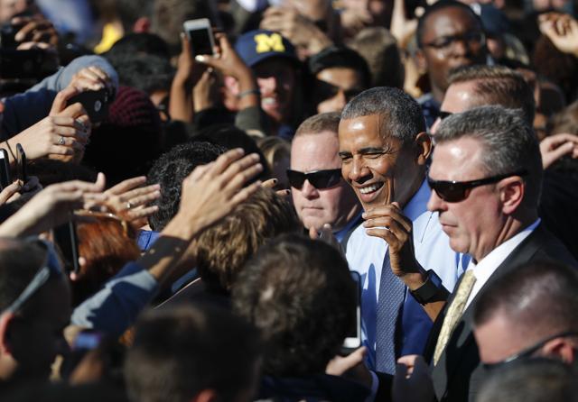 President Barack Obama greets supporters after speaking at the University of Michigan in Ann Arbor, Michigan during a campaign rally for Democratic presidential candidate Hillary Clinton. (AP)