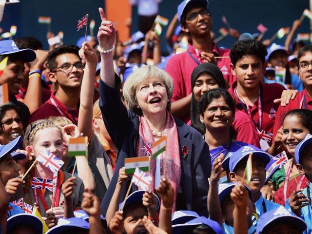 British Prime Minister Theresa May with students during her visit to Stonehill Government Higher Primary School on the outsikrts of Bengaluru. (PTI Photo) British Prime Minister Theresa May with students during her visit to Stonehill Government Higher Primary School on the outsikrts of Bengaluru. (PTI Photo)