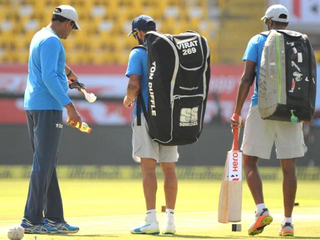 Indian coach Anil Kumble (L) inspects the pitch with captain Virat Kohli and Ravichandran Ashwin (R). (AFP)