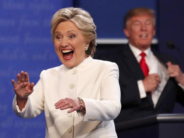 On the eve of the final US presidential debate Hillary Clinton’s chances of winning stood at 87.2%, according to the FiveThirtyEight election forecast, with Donald Trump at 12.7%. Here the Democratic US presidential nominee waves to the audience as she walks off the debate stage as Republican US presidential nominee remains at his podium. (REUTERS Photo)