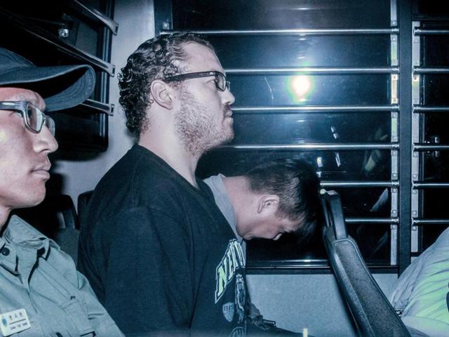 File photo of British banker Rurik Jutting smiling as he sits in a prison van leaving a court in Hong Kong. Jutting was found guilty on November 8, 2016 of the murder of two Indonesian women. (AFP) File photo of British banker Rurik Jutting smiling as he sits in a prison van leaving a court in Hong Kong. Jutting was found guilty on November 8, 2016 of the murder of two Indonesian women. (AFP)