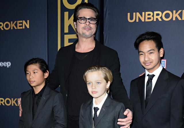 Brad Pitt and children Pax Jolie-Pitt (L), Shiloh Jolie-Pitt (C) and Maddox Jolie-Pitt arrive for the US premiere of Universal Pictures Unbroken in 2014. (AFP)