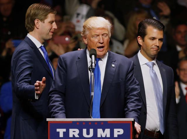 Republican US presidential nominee Donald Trump gets smiles from his sons Eric Trump (L) and Donald Trump Jr. (R) as they leave him to take the stage to rally with supporters at an arena in Manchester, New Hampshire. (REUTERS) Republican US presidential nominee Donald Trump gets smiles from his sons Eric Trump (L) and Donald Trump Jr. (R) as they leave him to take the stage to rally with supporters at an arena in Manchester, New Hampshire. (REUTERS)