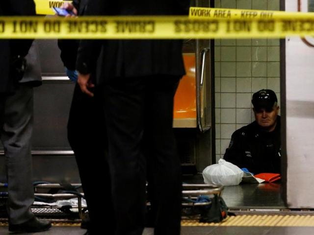 Members of the New York City police (NYPD) work at the scene after a commuter was pushed in front of a subway train as it arrived at Times Square station in New York City on Monday. (Reuters) Members of the New York City police (NYPD) work at the scene after a commuter was pushed in front of a subway train as it arrived at Times Square station in New York City on Monday. (Reuters)