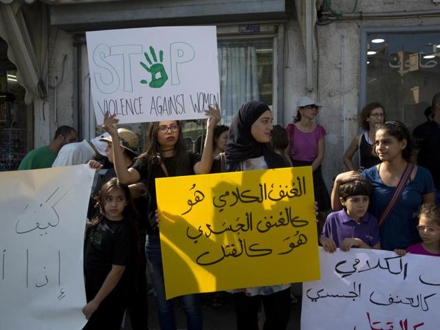 Israeli Arab women hold signs during a demonstration in Jaffa, Israel. Arabic sign reads:"Verbal violence, is like physical violence, is like murder." (AP Photo) Israeli Arab women hold signs during a demonstration in Jaffa, Israel. Arabic sign reads:"Verbal violence, is like physical violence, is like murder." (AP Photo)