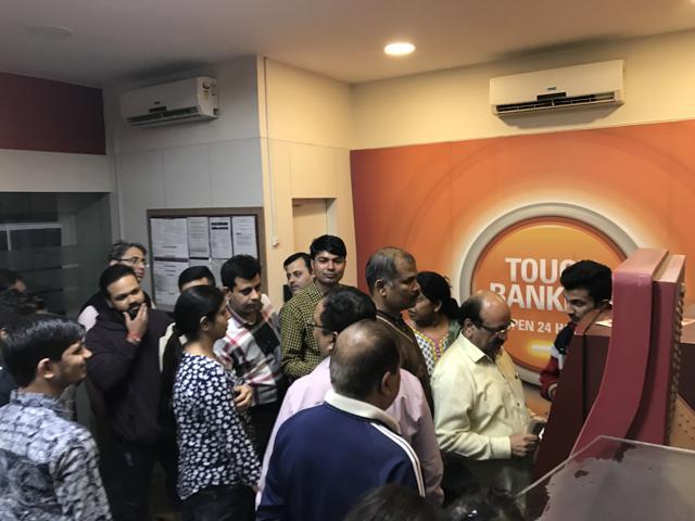 Tension among people rushing to withdraw a suitable cash at the earliest was reported at some ATMs. (Ravi Choudhary/HT Photo) Tension among people rushing to withdraw a suitable cash at the earliest was reported at some ATMs. (Ravi Choudhary/HT Photo)