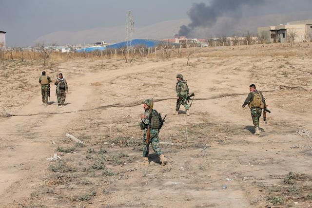 Peshmerga forces carry weapons near the town of Bashiqa, east of Mosul, during an operation to attack Islamic State militants in Mosul, Iraq on Monday. (Reuters) Peshmerga forces carry weapons near the town of Bashiqa, east of Mosul, during an operation to attack Islamic State militants in Mosul, Iraq on Monday. (Reuters)