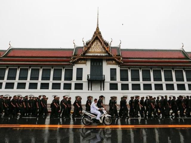 Visitors take photos as mahouts lead a procession of 11 white elephants outside the Grand Palace in honour of Thailand's King Bhumibol Adulyadej in Bangkok on November 8, 2016. King Bhumibol died on October 13 after reigning for 70 years and the official mourning period is one year. (AP) Visitors take photos as mahouts lead a procession of 11 white elephants outside the Grand Palace in honour of Thailand's King Bhumibol Adulyadej in Bangkok on November 8, 2016. King Bhumibol died on October 13 after reigning for 70 years and the official mourning period is one year. (AP)