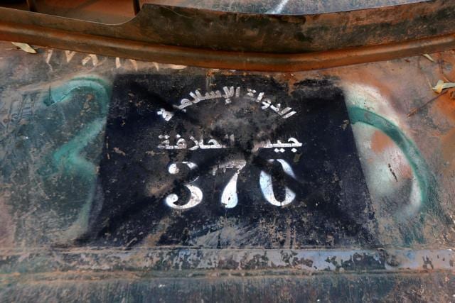 Soldiers of the Iraqi army display items confiscated from Islamic State (IS) group jihadists, in the town of Qaraqosh, 30 km east of Mosul. (AFP) Soldiers of the Iraqi army display items confiscated from Islamic State (IS) group jihadists, in the town of Qaraqosh, 30 km east of Mosul. (AFP)