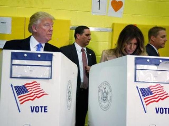 Republican presidential nominee Donald Trump and his wife Melania Trump vote at PS 59 in New York on Election Day. (REUTERS)