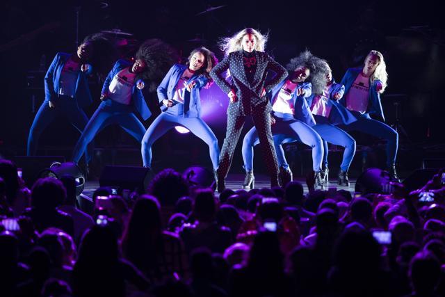 Singer Beyonce, who performed during a campaign rally for Democratic presidential candidate Hillary Clinton in Cleveland, opted for a pantsuit with a high-neck top. (Matt Rourke/AP) Singer Beyonce, who performed during a campaign rally for Democratic presidential candidate Hillary Clinton in Cleveland, opted for a pantsuit with a high-neck top. (Matt Rourke/AP)