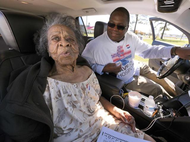 Grace Bell Hardison, a 100-year-old woman recently mentioned by President Barack Obama after attempts were made to purge her from the voter registration list and hence deny her right to vote, reacts after a kiss from her nephew Greg Satterthwaite after she voted in the U.S. general election from his car in Belhaven, North Carolina. (REUTERS) Grace Bell Hardison, a 100-year-old woman recently mentioned by President Barack Obama after attempts were made to purge her from the voter registration list and hence deny her right to vote, reacts after a kiss from her nephew Greg Satterthwaite after she voted in the U.S. general election from his car in Belhaven, North Carolina. (REUTERS)