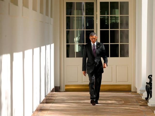 US President Barack Obama walks the Colonnade toward the Oval Office of the White House in Washington on election day.(Reuters)