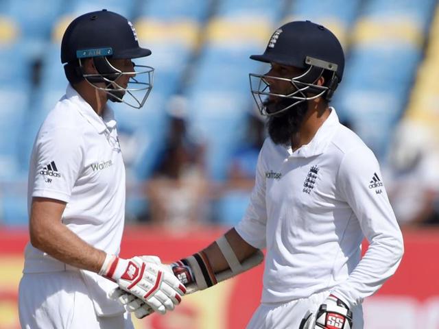 England's Joe Root (L) is congratulated by teammate Moeen Ali after scoring a half-century (50 runs) on the first day of the first Test cricket match between India and England. (AFP Photo) England's Joe Root (L) is congratulated by teammate Moeen Ali after scoring a half-century (50 runs) on the first day of the first Test cricket match between India and England. (AFP Photo)
