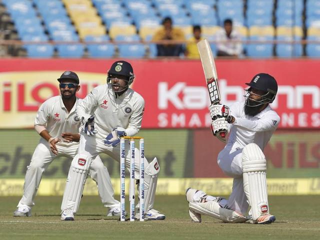 England's Moeen Ali (R) watches the ball after playing a shot as India's wicketkeeper Wriddhiman Saha (C) and Ajinkya Rahane look on. (REUTERS) England's Moeen Ali (R) watches the ball after playing a shot as India's wicketkeeper Wriddhiman Saha (C) and Ajinkya Rahane look on. (REUTERS)