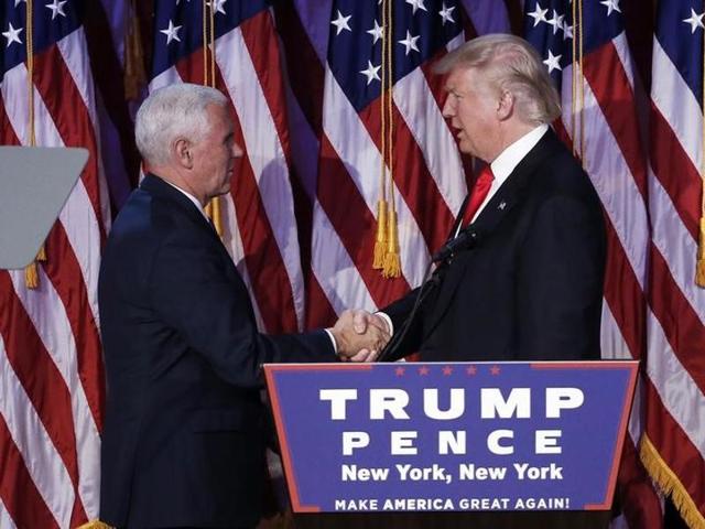 US President-elect Donald Trump greets his running mate Mike Pence during his election night rally in Manhattan on November 9, 2016. (mike segar/reuters) US President-elect Donald Trump greets his running mate Mike Pence during his election night rally in Manhattan on November 9, 2016. (mike segar/reuters)