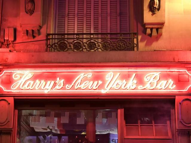 People stand outside the Harry's New York Bar in Paris.(AFP Photo)