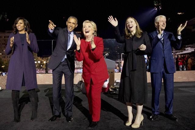 Democratic presidential candidate Hillary Clinton (centre) is joined on stage by her daughter Chelsea Clinton (centre right), husband and former president Bill Clinton (right), first lady Michelle Obama (left), and President Barack Obama (centre left) after speaking at a rally at Independence Mall in Philadelphia on Monday. (AP) Democratic presidential candidate Hillary Clinton (centre) is joined on stage by her daughter Chelsea Clinton (centre right), husband and former president Bill Clinton (right), first lady Michelle Obama (left), and President Barack Obama (centre left) after speaking at a rally at Independence Mall in Philadelphia on Monday. (AP)