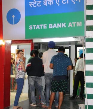 People in queue at an ATM to withdraw Rs 100 notes, or to deposit notes of Rs 500 and 1,000 through the machines, in Phase 7, SAS Nagar (Mohali), on Tuesday. (Anil dayal/HT Photo) People in queue at an ATM to withdraw Rs 100 notes, or to deposit notes of Rs 500 and 1,000 through the machines, in Phase 7, SAS Nagar (Mohali), on Tuesday. (Anil dayal/HT Photo)