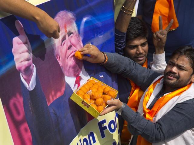 Activists belonging to 'Hindu Sena' offer sweets to US President-elect Donald Trump.(AP Photo) Activists belonging to 'Hindu Sena' offer sweets to US President-elect Donald Trump.(AP Photo)