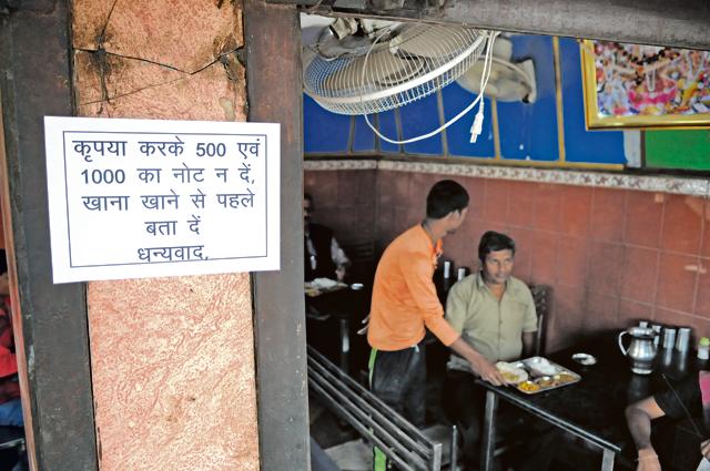 A notice outside an eatery says Rs 500 and 1000 notes won’t be accepted. A notice outside an eatery says Rs 500 and 1000 notes won’t be accepted.