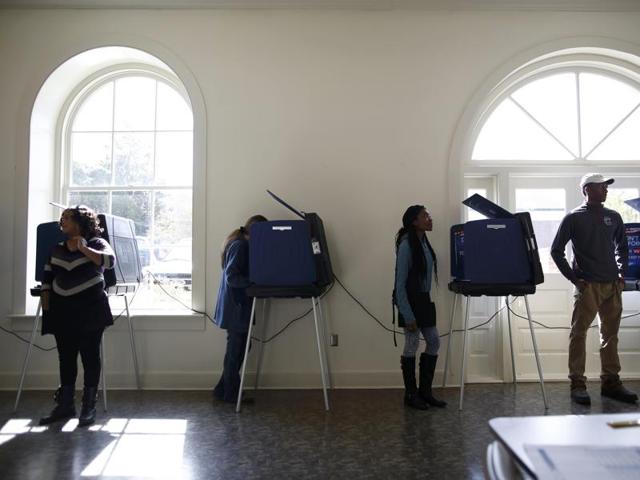 Poll workers and voters stand by the voting machines at the Marion 2 precinct at the Marion Opera House during the U.S. presidential election in Marion, South Carolina. (REUTERS) Poll workers and voters stand by the voting machines at the Marion 2 precinct at the Marion Opera House during the U.S. presidential election in Marion, South Carolina. (REUTERS)