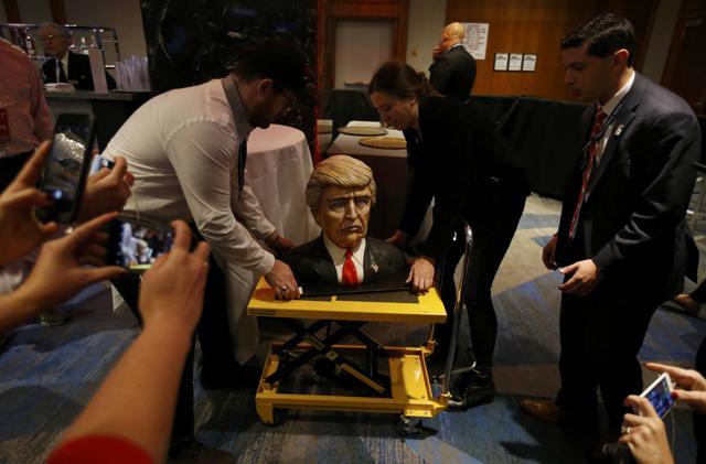 A cake in the form of Republican US presidential nominee Donald Trump is brought into the hotel where his election night rally will be held in Manhattan, New York, US. (Reuters Photo) A cake in the form of Republican US presidential nominee Donald Trump is brought into the hotel where his election night rally will be held in Manhattan, New York, US. (Reuters Photo)