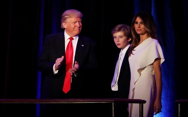 Republican president-elect Donald Trump walks on stage with his son Barron Trump (centre), and wife Melania Trump during his election night event in New York City. (AFP Photo) Republican president-elect Donald Trump walks on stage with his son Barron Trump (centre), and wife Melania Trump during his election night event in New York City. (AFP Photo)