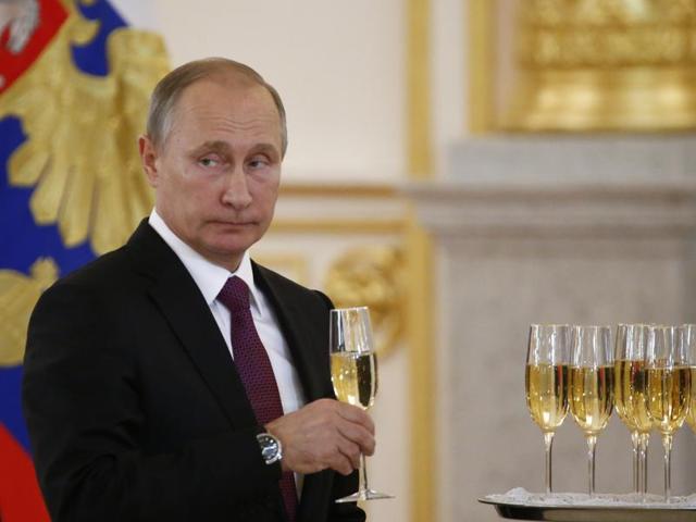 Russian President Vladimir Putin holds a glass during a ceremony of receiving diplomatic credentials from foreign ambassadors in the Kremlin in Moscow, Russia, Wednesday, Nov 9, 2016. (AP) Russian President Vladimir Putin holds a glass during a ceremony of receiving diplomatic credentials from foreign ambassadors in the Kremlin in Moscow, Russia, Wednesday, Nov 9, 2016. (AP)