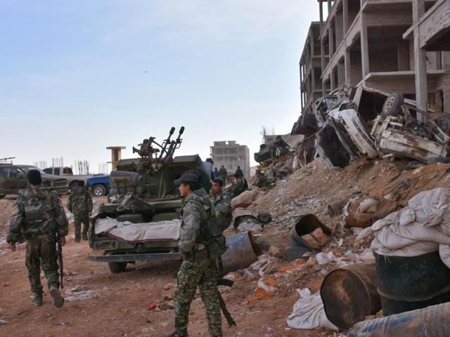 Syrian pro-government forces hold a position in Aleppo's 1070 district on November 8 after seizing it from rebel fighters. (AFP) Syrian pro-government forces hold a position in Aleppo's 1070 district on November 8 after seizing it from rebel fighters. (AFP)