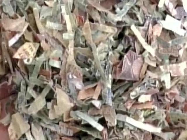 Shredded currency notes were found in two sacks in Bareilly. (ANI Photo) Shredded currency notes were found in two sacks in Bareilly. (ANI Photo)