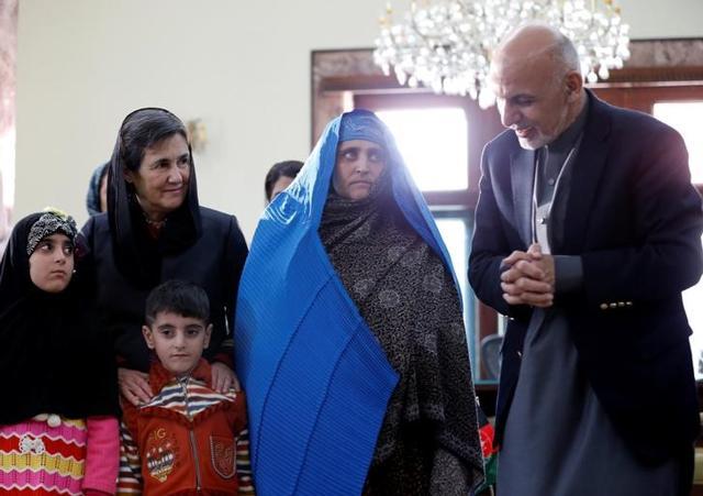 President Ashraf Ghani speaks to Sharbat Gula in Kabul (Reuters ) President Ashraf Ghani speaks to Sharbat Gula in Kabul (Reuters )