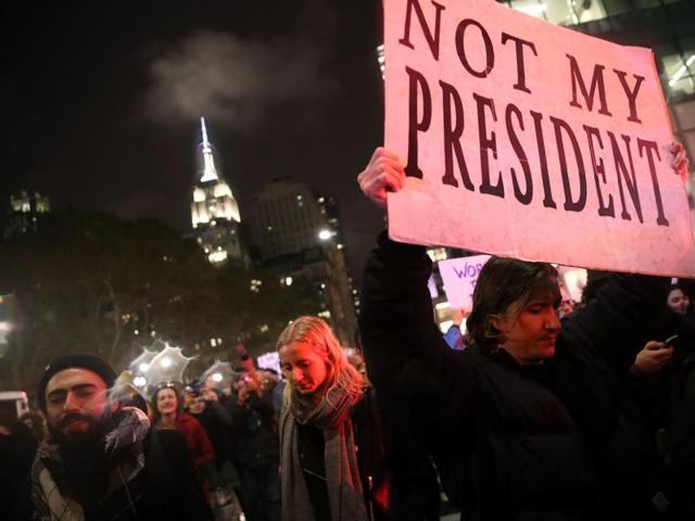 Hundreds of anti-Donald Trump protestors march through the street on 6th Avenue on their way to Trump Tower, November 9, 2016 in New York City.(AFP)