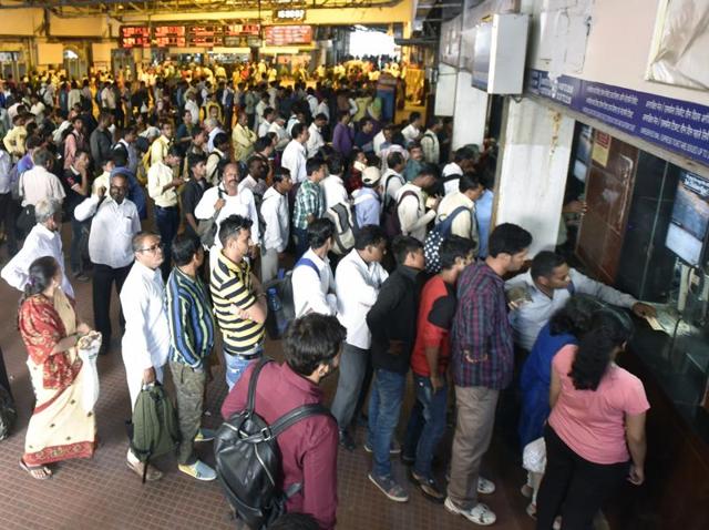 Travellers stand in a long queue at CST station in Mumbai on Wednesday.(Kunal Patil/Hindustan Times)