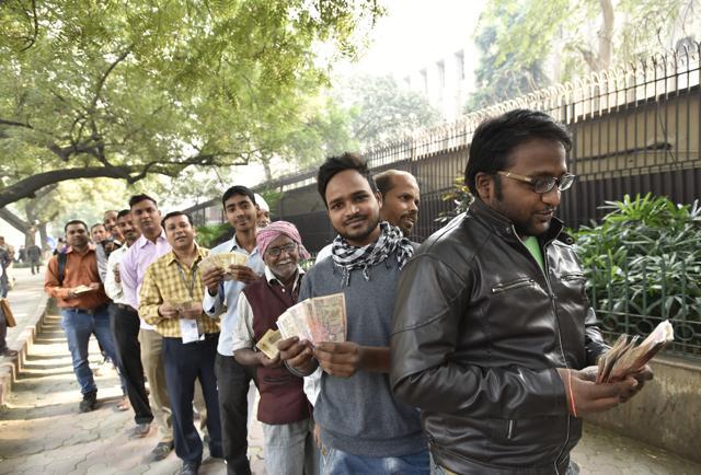 People wait outside the Reserve Bank of India in New Delhi on Thursday. (Arvind Yadav/HT Photo) People wait outside the Reserve Bank of India in New Delhi on Thursday. (Arvind Yadav/HT Photo)