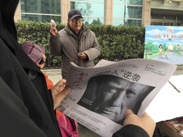 Zheng Gao of Shanghai, China, photographs the front pages of newspapers on display outside the Newseum in Washington on Wednesday, the day after Donald Trump won the presidency. (AP) Zheng Gao of Shanghai, China, photographs the front pages of newspapers on display outside the Newseum in Washington on Wednesday, the day after Donald Trump won the presidency. (AP)