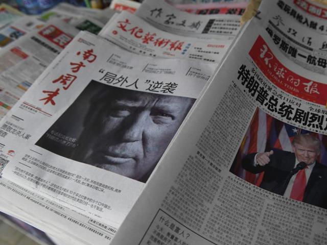 Chinese newspapers feature front page photos of US President-elect Donald Trump, at a news stand in Beijing on November 10, 2016. (AFP) Chinese newspapers feature front page photos of US President-elect Donald Trump, at a news stand in Beijing on November 10, 2016. (AFP)