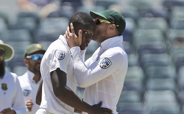 South Africa's captain Faf du Plessis kisses Kagiso Rabada on the top of the head after he took the wicket of Australia's Mitchell Starc. Rabada took 5/91 to script 177-runs win against Australia in Perth. (AP) South Africa's captain Faf du Plessis kisses Kagiso Rabada on the top of the head after he took the wicket of Australia's Mitchell Starc. Rabada took 5/91 to script 177-runs win against Australia in Perth. (AP)