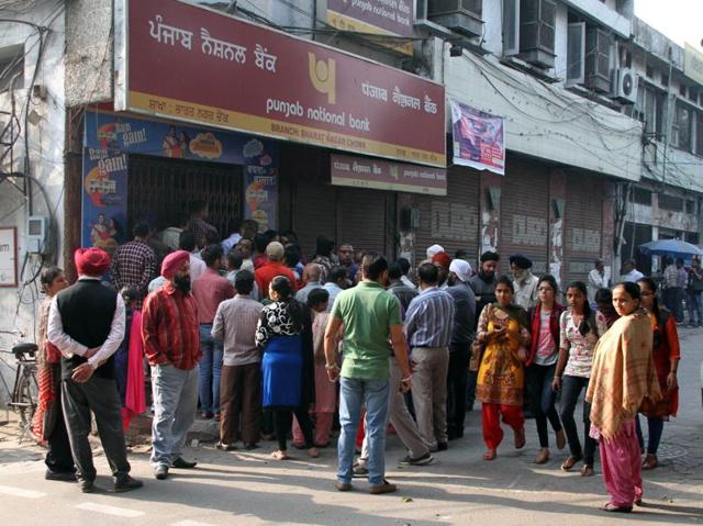 Huge rush outside Punjab National bank near Bharat Nagar Chowk in Ludhiana even before the opening hours on Thursday. (JS Grewal/HT Photo) Huge rush outside Punjab National bank near Bharat Nagar Chowk in Ludhiana even before the opening hours on Thursday. (JS Grewal/HT Photo)