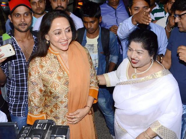 Bollywood actor and MP Hema Malini with late music director Ravindra Jain's wife Divya Jain during the inauguration of Ravindra Jain Chowk in Mumbai. (PTI Photo)