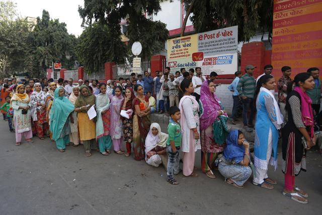 People stands in queue outside a post office to deposit and exchange Rs 500 and Rs 1000 currency notes, in Ahmedabad. (AP Photo) People stands in queue outside a post office to deposit and exchange Rs 500 and Rs 1000 currency notes, in Ahmedabad. (AP Photo)
